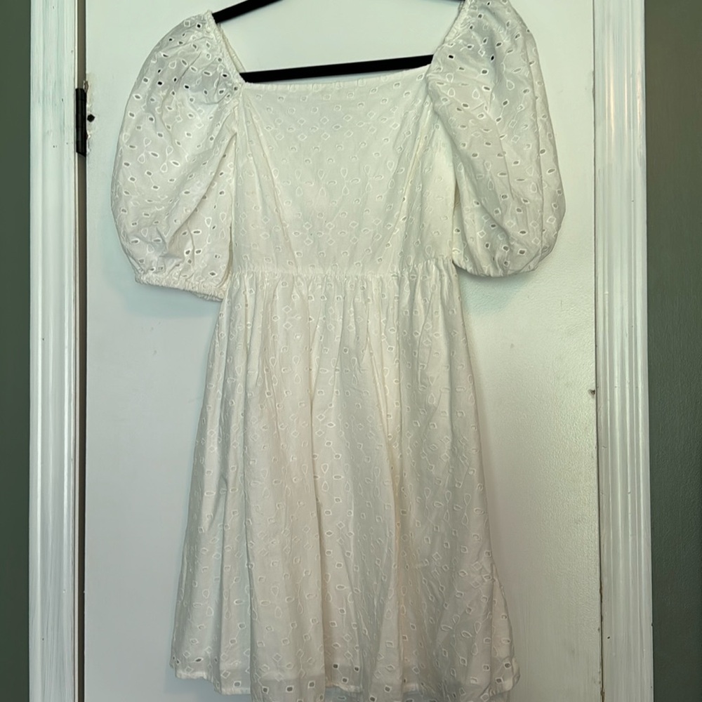 White eyelet cut out back dress.